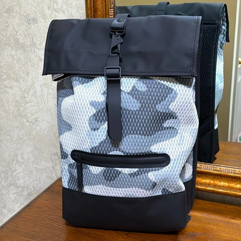 New Rains Black and Gray Unisex camo look Backpack.